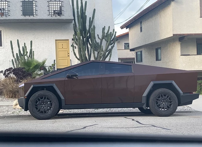 a-brown-tesla-cybertruck-the-official-car-of-v0-uqq1q4xhfync1.png